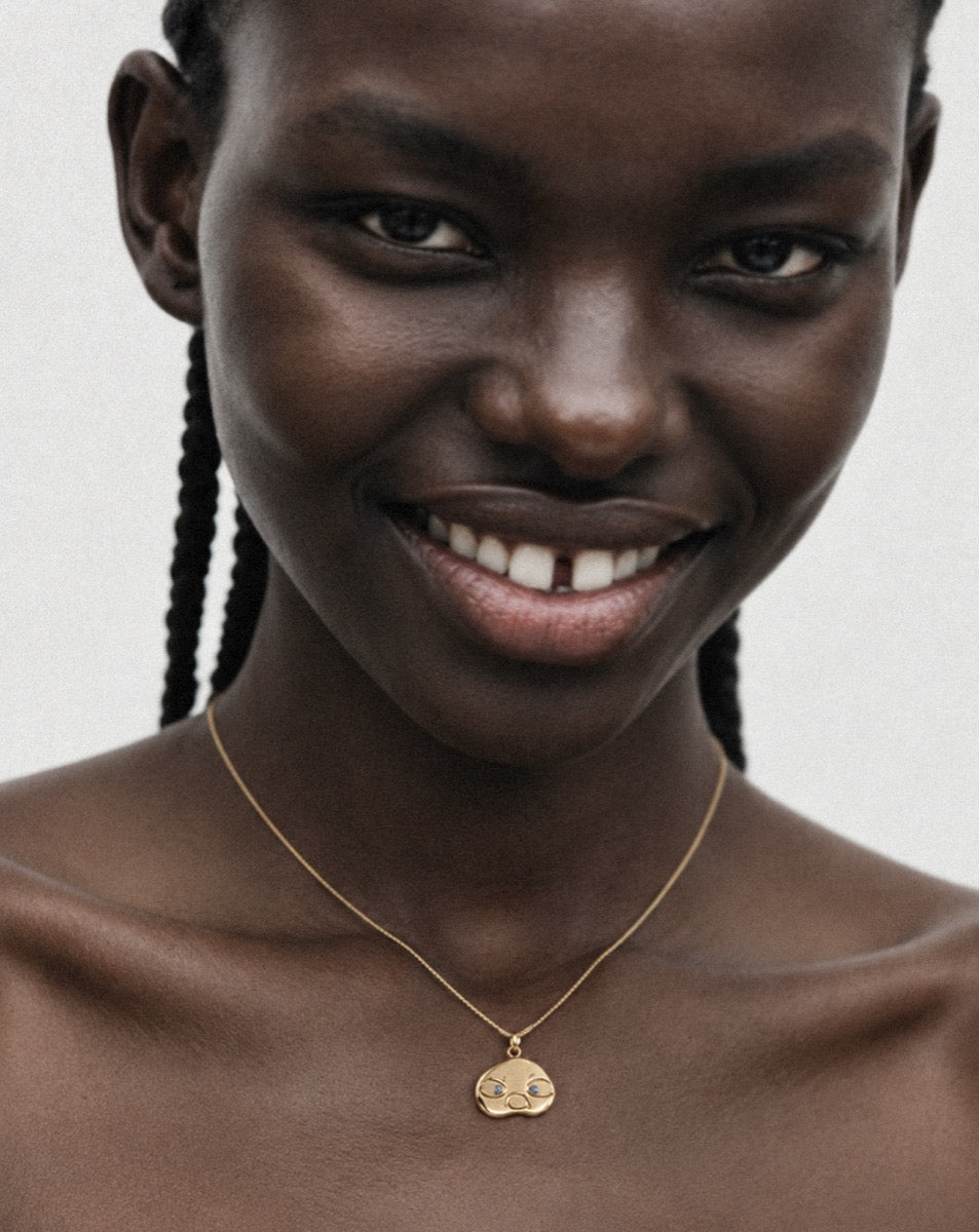 Thinker medallion necklace, gold plated vermeil finish, lifestyle